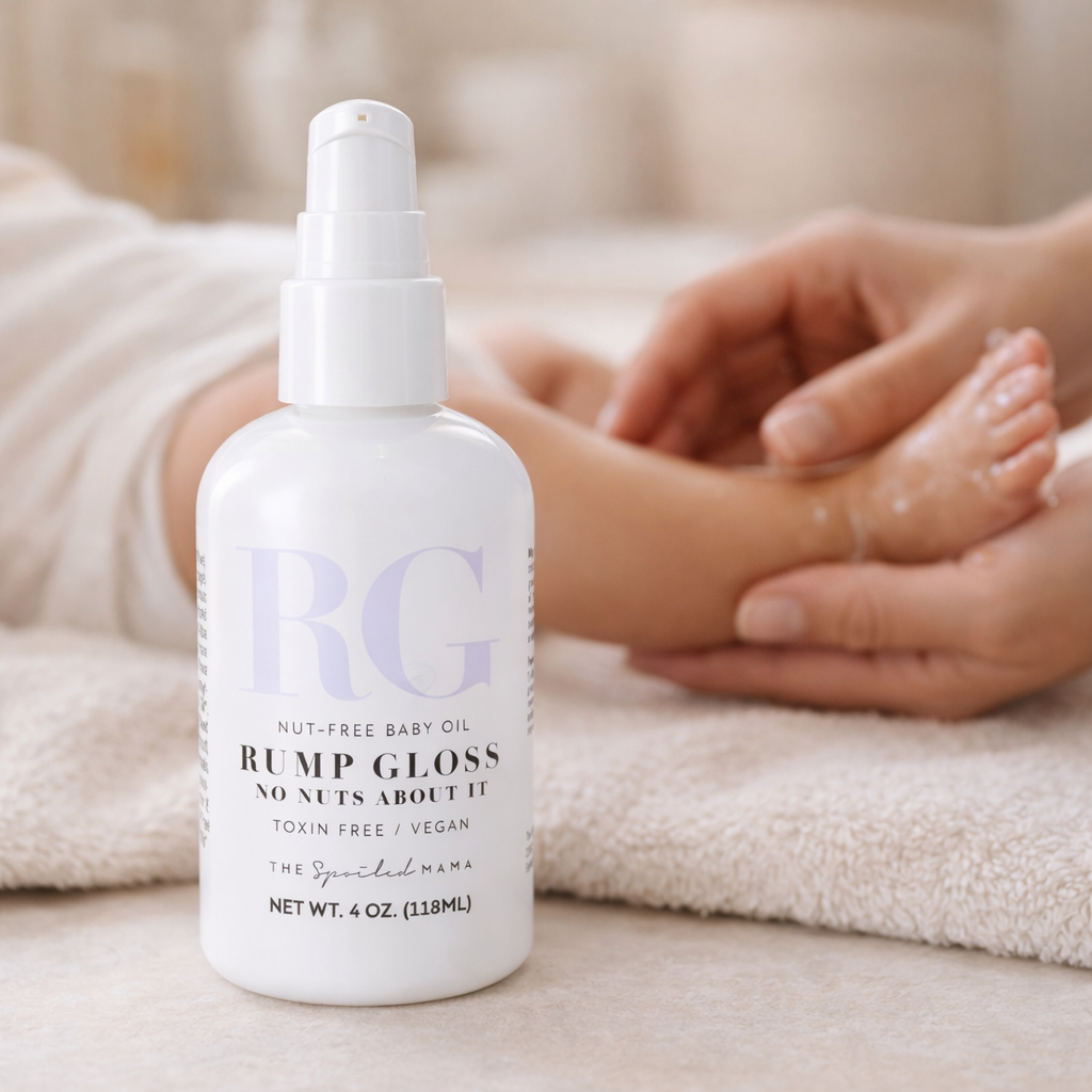 Nut-free baby oil being rubbed into a babys feet by mom