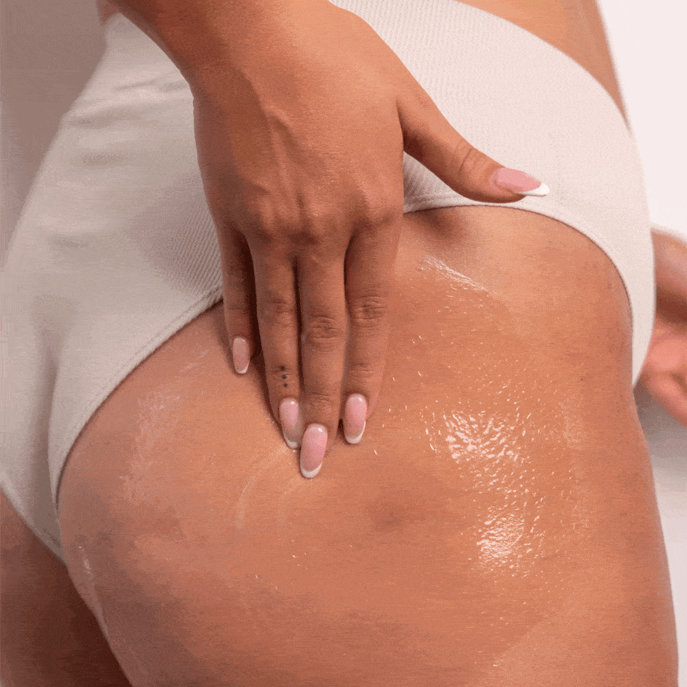 Woman rubbing postpartum cellulite gel