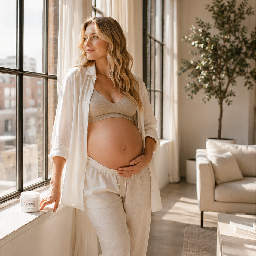 Pregnant woman applying The Spoiled Mama pregnancy body oil, reflecting the brand's commitment to ingredient transparency and clean pregnancy skincare.